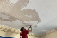 Ceiling plaster scraping