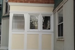 Restored glass beside entry